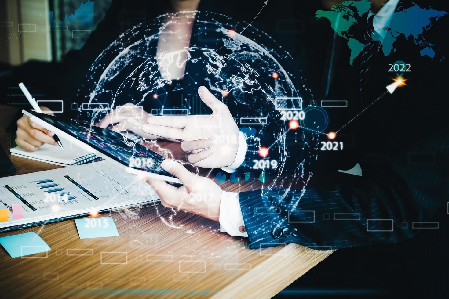 Businessman and business woman discuss to working with using tablet and for searching information stock market chart for trading to Make a profit. Planning and Investment concept. photo
