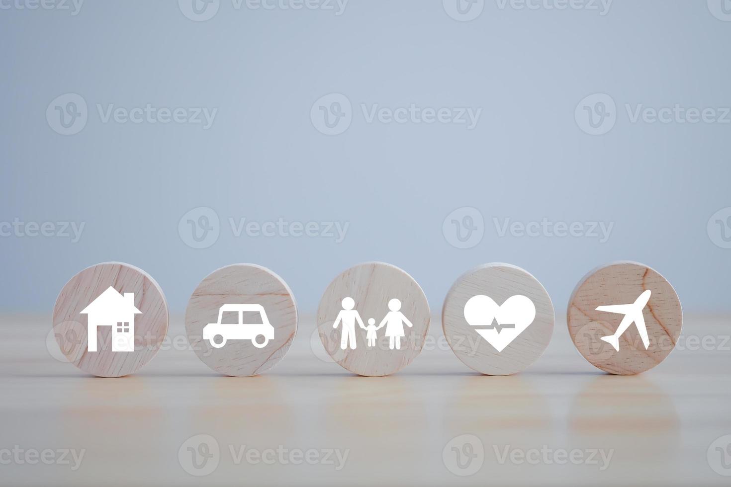 Insurance concept. Protection against a possible eventuality. House, Car, Family, healthcare and travel icon on wooden block for assurance life concept. photo