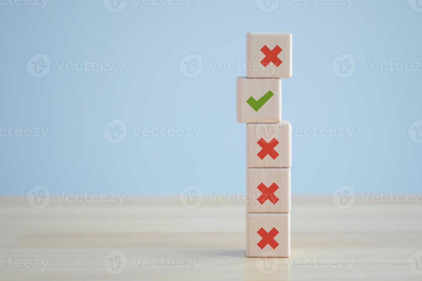 Individuality, Unique, Unswerving, Steady. Green correct check mark among many red wrong or cross icon on wooden circle for true or false changing mindset. Not changing or becoming weaker. photo