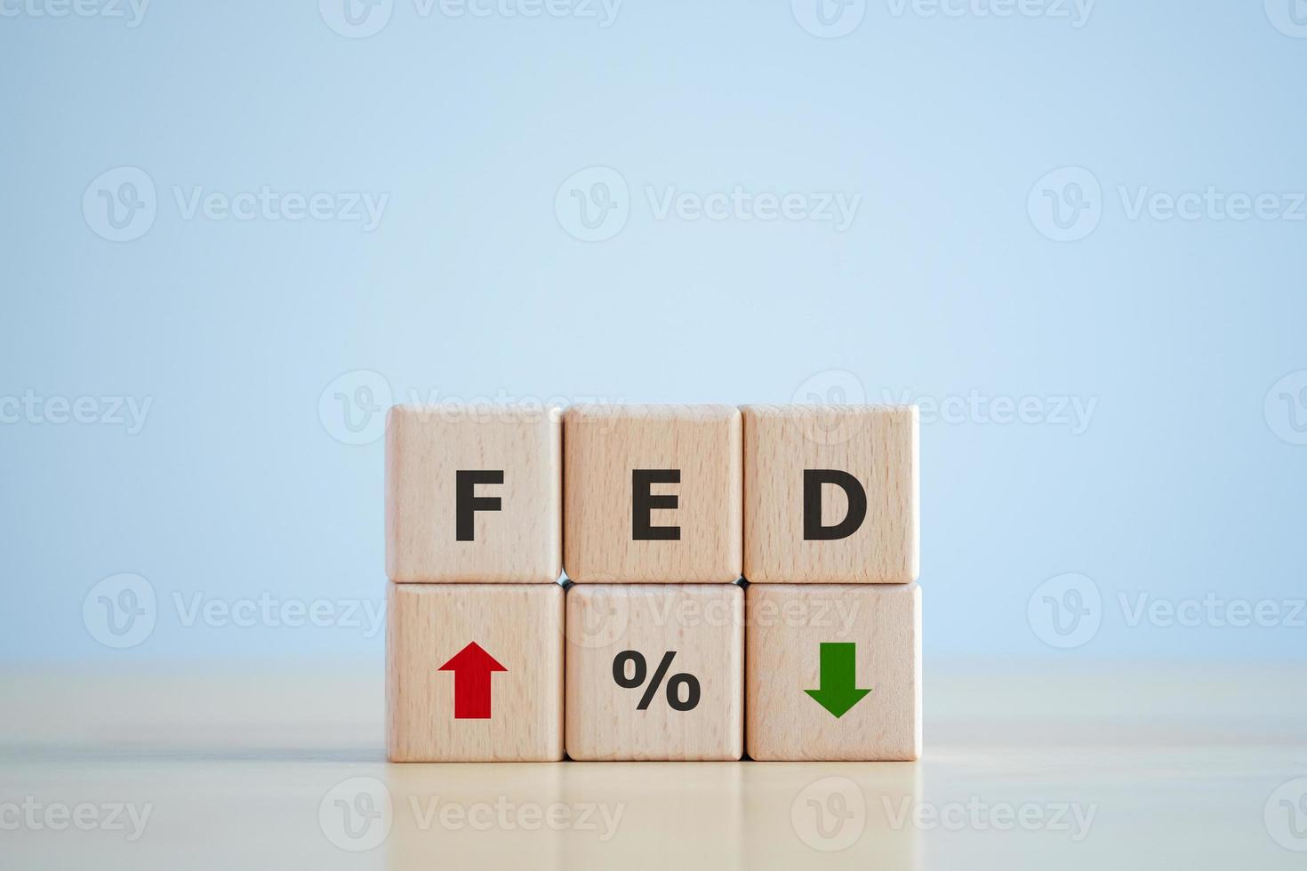 FED, federal reserve, Control interest rates, Inflation, Interest rates. World economy crisis, American economy and business concept. FED on Wooden block with Percentage sign and arrow up and down. photo