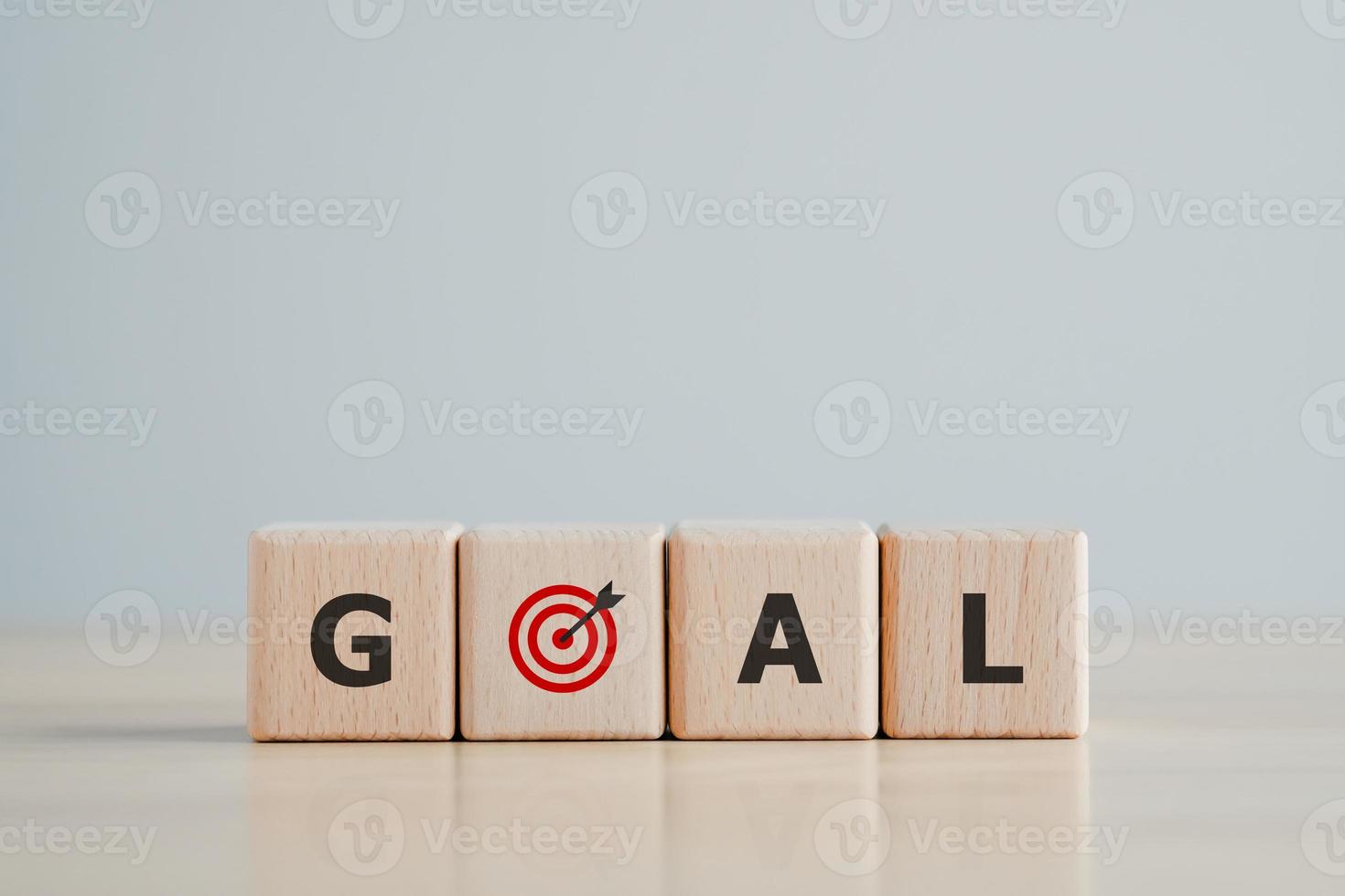 GOAL word on wooden block with dart board. Background for Life target or Business marketing goal. Business achievement goal and objective target. photo