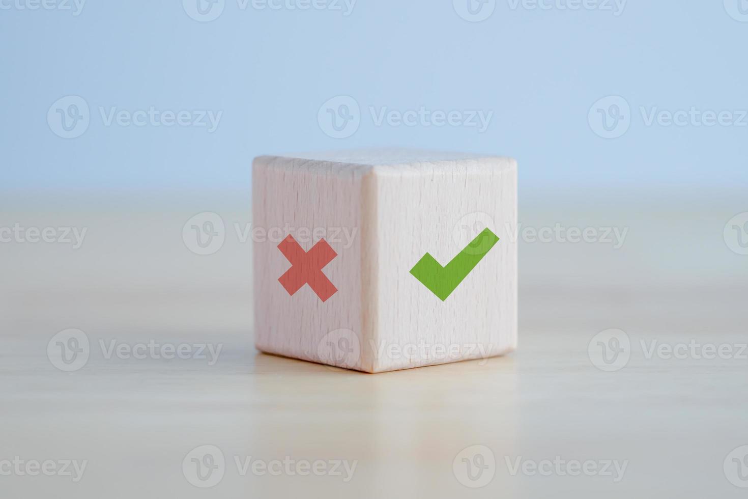 Green correct check mark and red wrong or cross icon on wooden block for true or false changing mindset or way of adapting to change leader and transform quiz answer and poll concept. photo