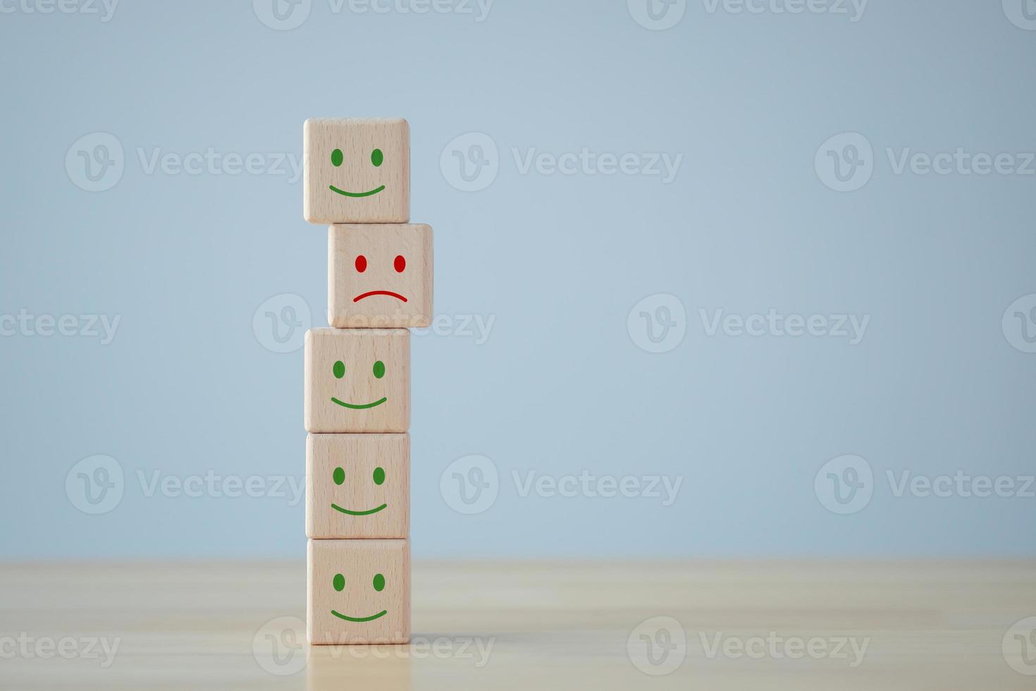 Unhappy face is among happy face. Customer dissatisfaction or unhappy client. Feedback rating, Satisfaction, Customer service review, Mental health assessment, World mental health day concept. photo