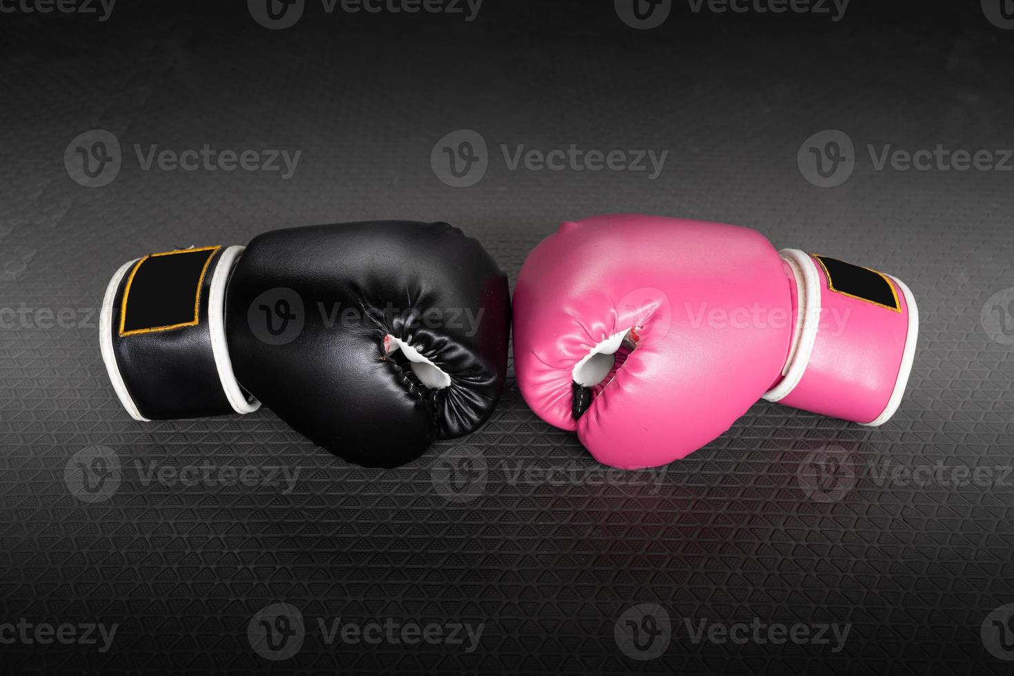 pink and black Boxing glove in punching in woman concept. photo