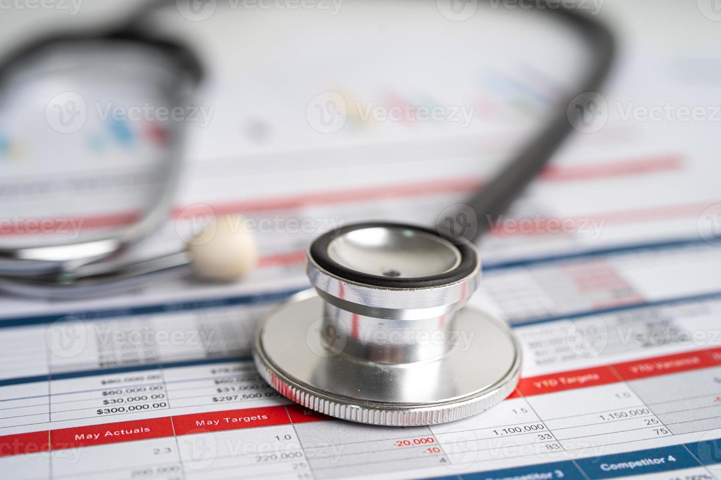 Spreadsheet table paper with stethoscope. Finance development, Banking Account, Statistics Investment Analytic research data economy, trading. photo