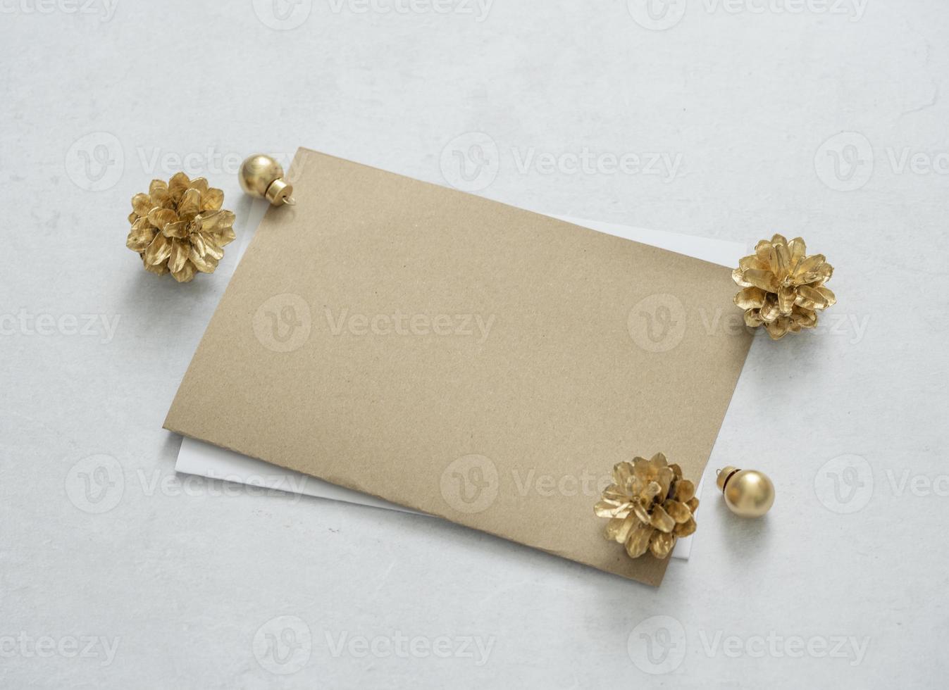 Mockup for a letter or a wedding invitation with gold leaves eucalyptus branches. photo
