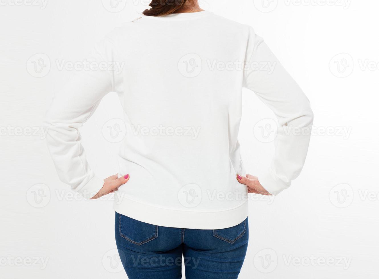 woman in white pullover posing on white background - back view cropped image photo