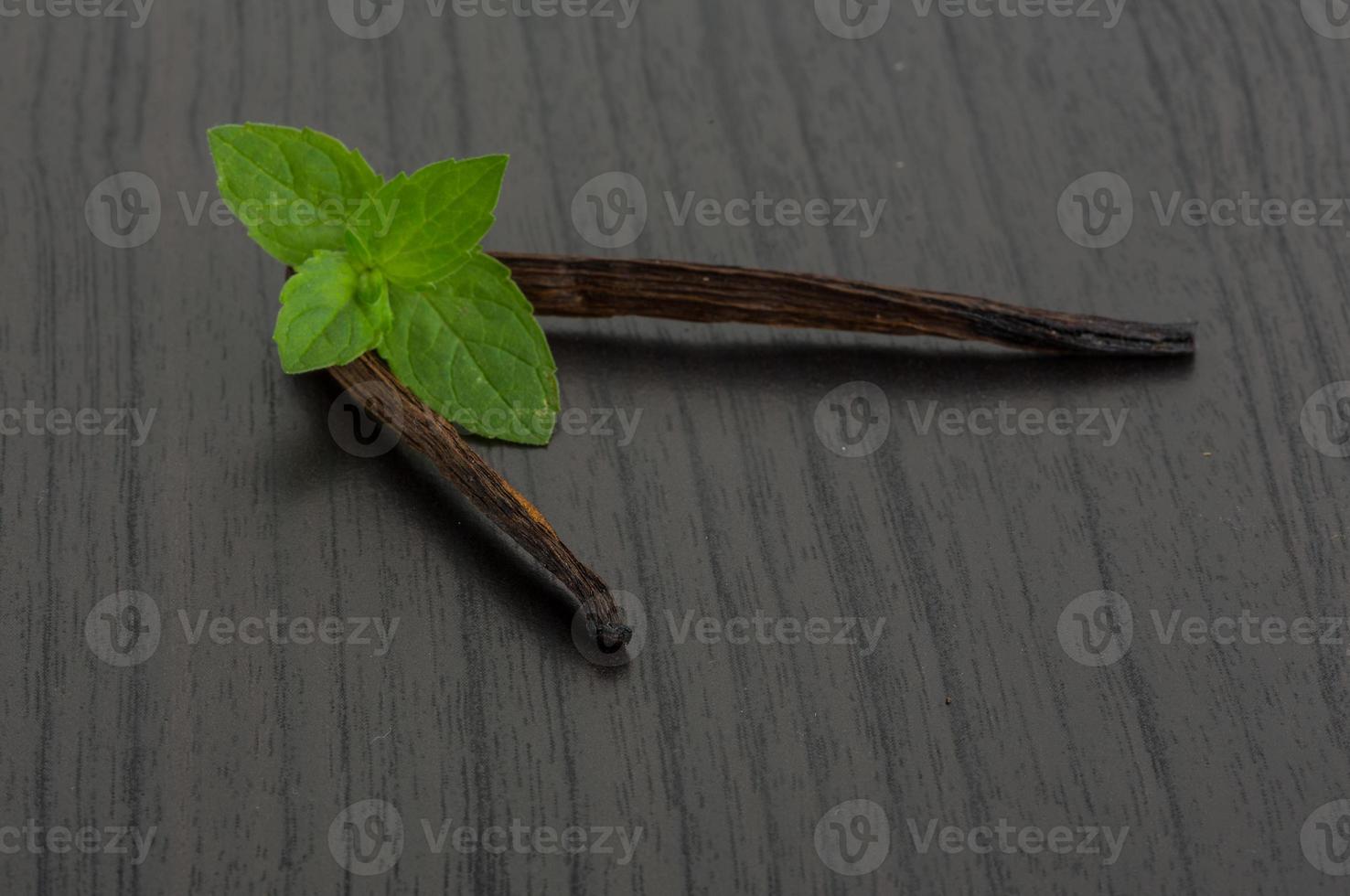 Vanilla on wooden background photo