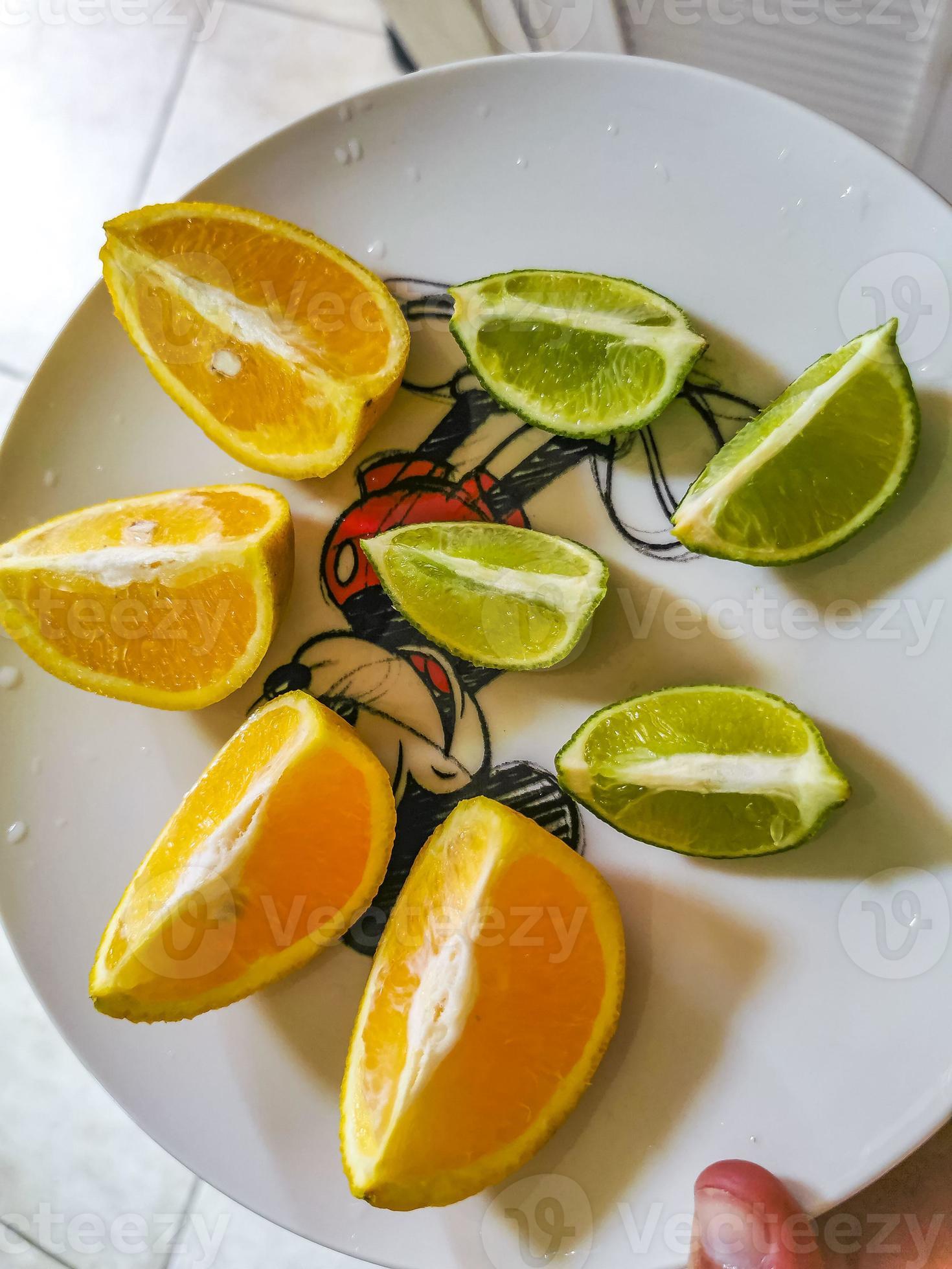 Oranges limes grapes lemon citrus fruits on plate Mexico. 11549233 Stock Photo at Vecteezy
