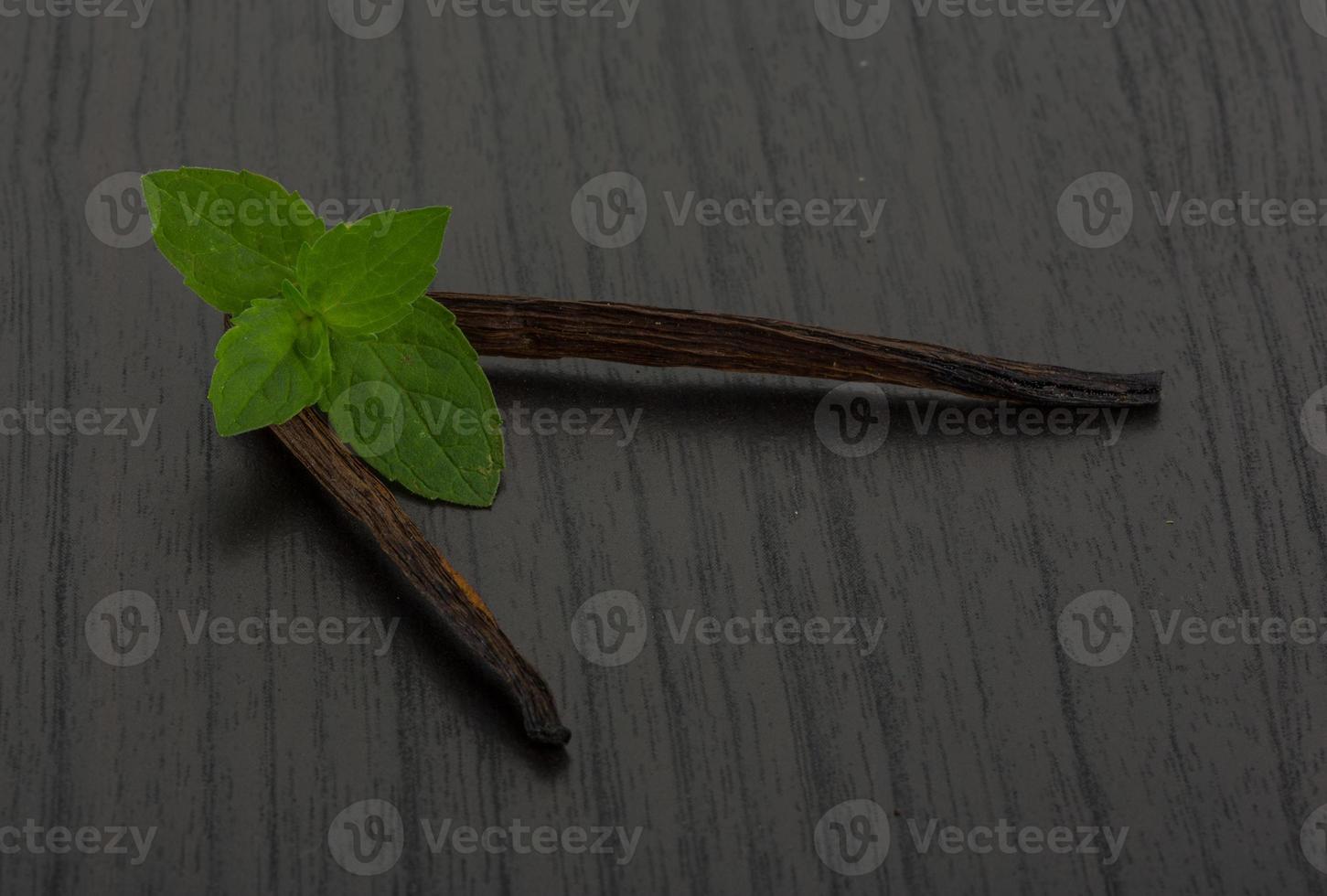 Vanilla on wooden background photo