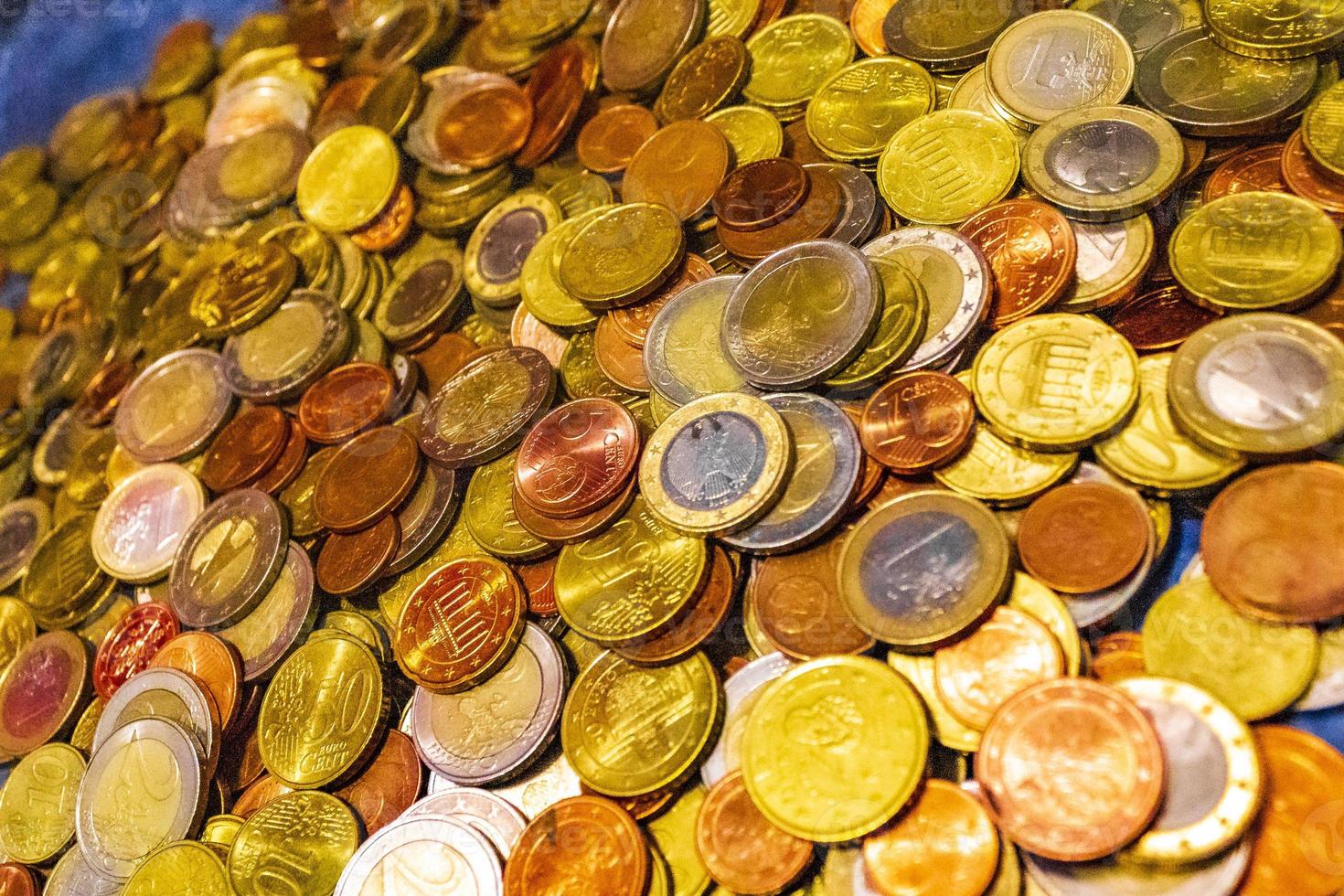 Saved euro coins and bills on blue background Germany. 11550027 Stock Photo  at Vecteezy