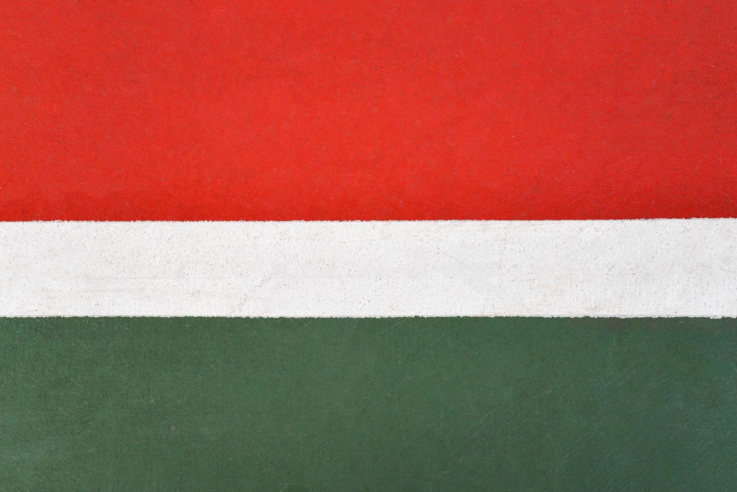 Green and red floor colorful painted on court sport outdoors with white line background photo