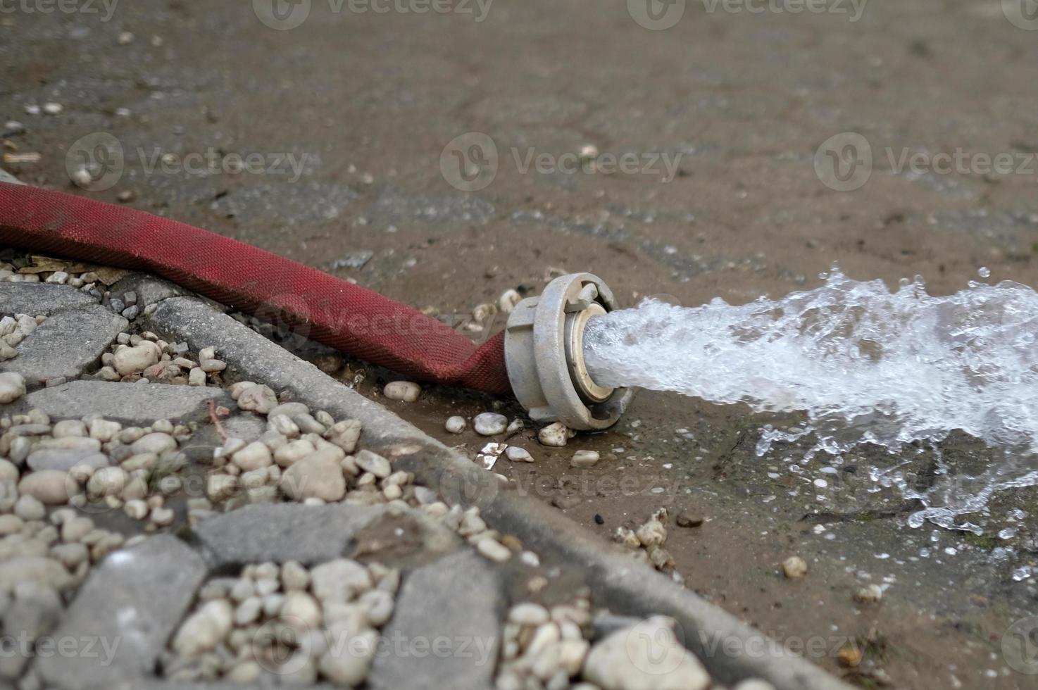 Extreme weather - water being pumped out of a flooded basement in Cologne, Germany, after heavy rain falls. photo