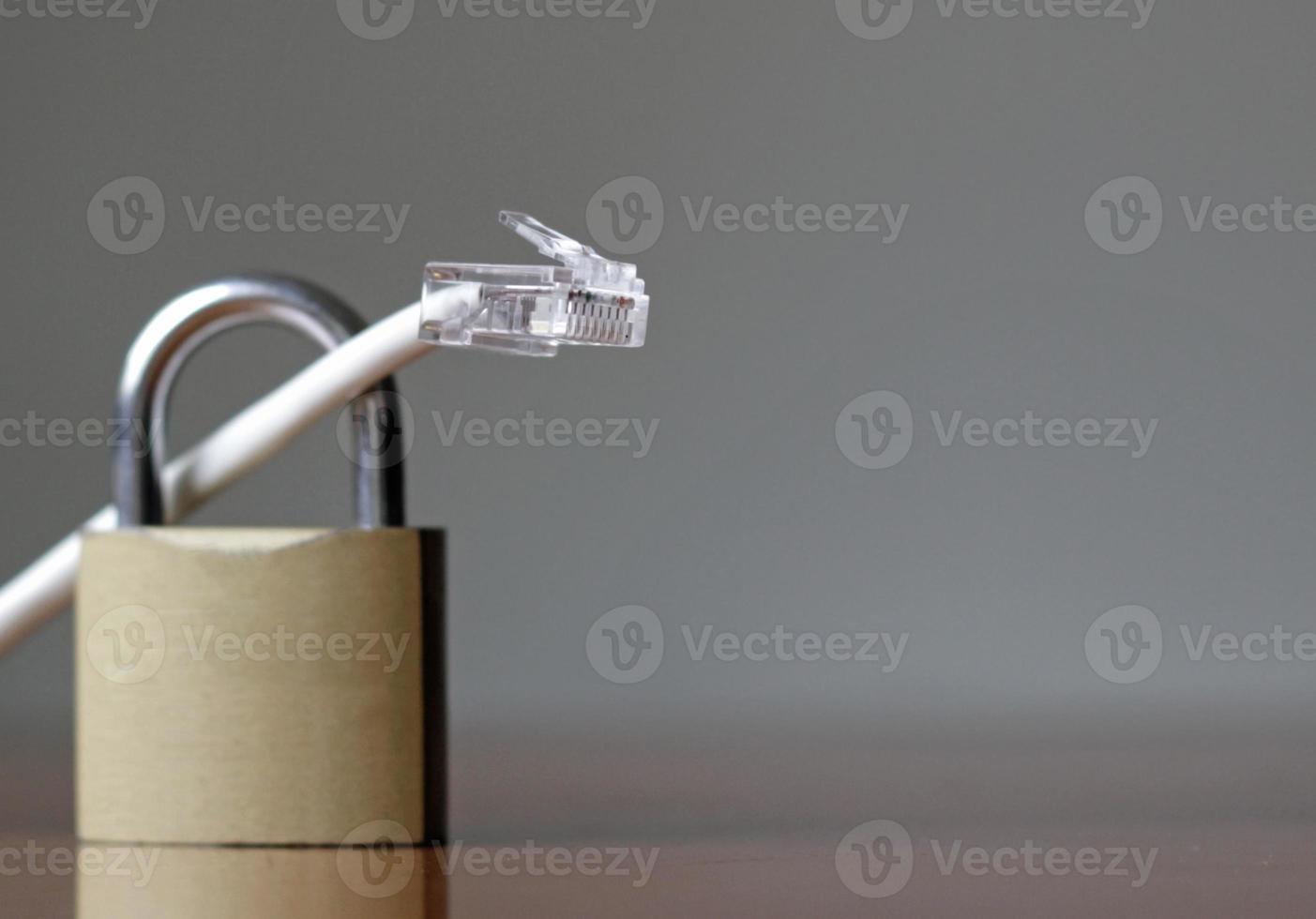 Network protection and secure access - network cable going through a padlock photo