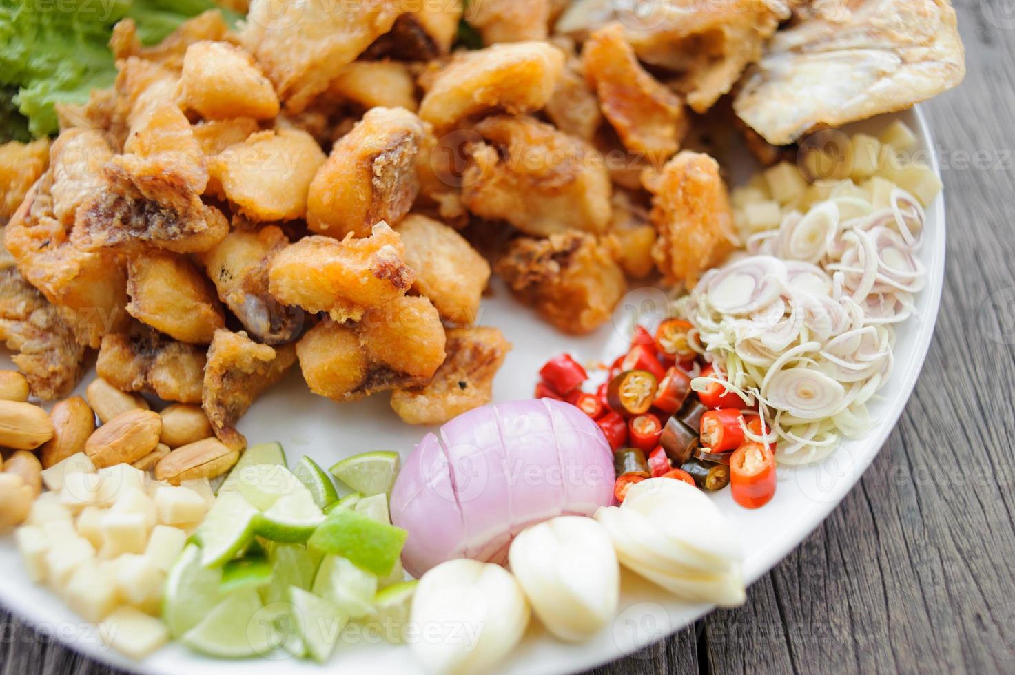 Fried snapper with chili sauce on the plate photo