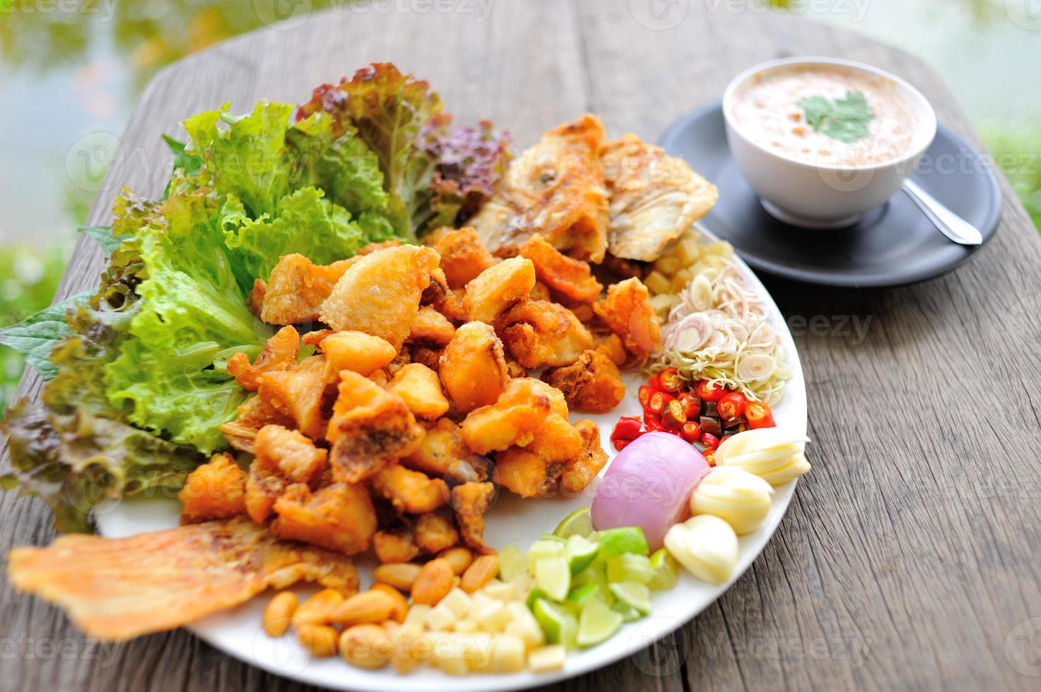 Fried snapper with chili sauce on the plate photo