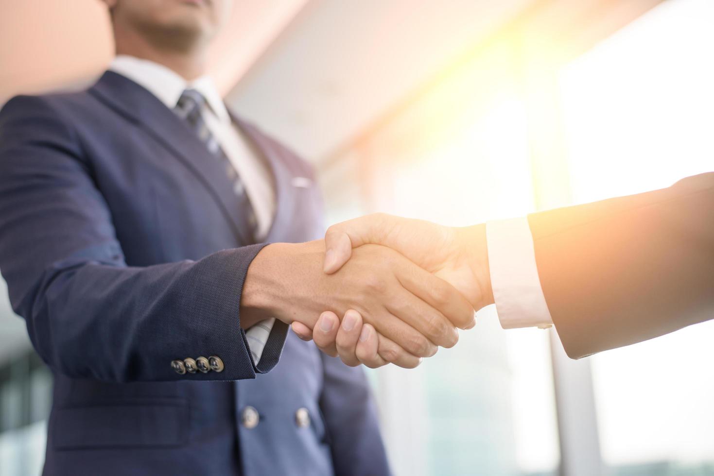 usiness people shaking hands, finishing up meeting photo