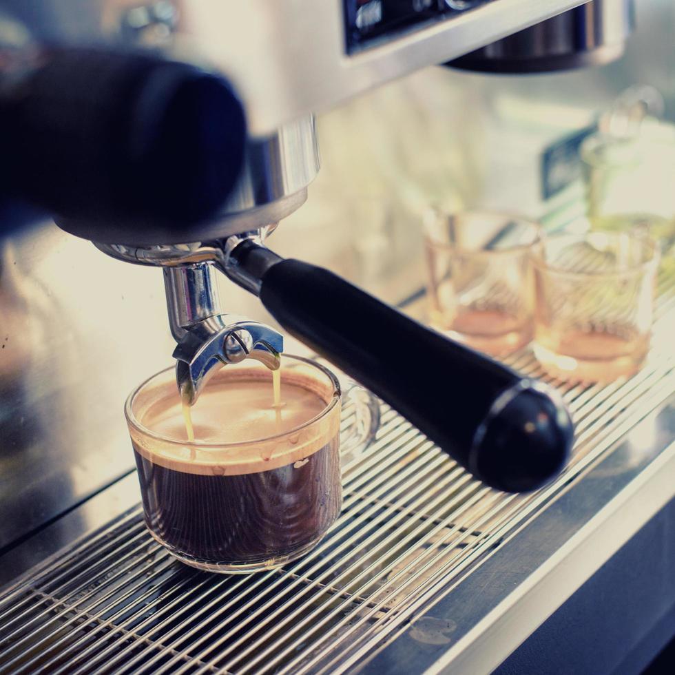 Espresso machine brewing a coffee photo