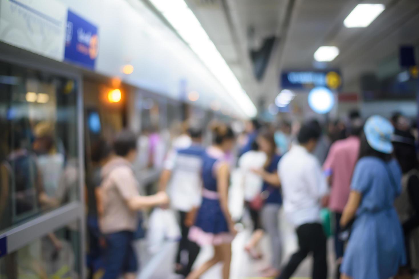 People on subway station blur motion photo