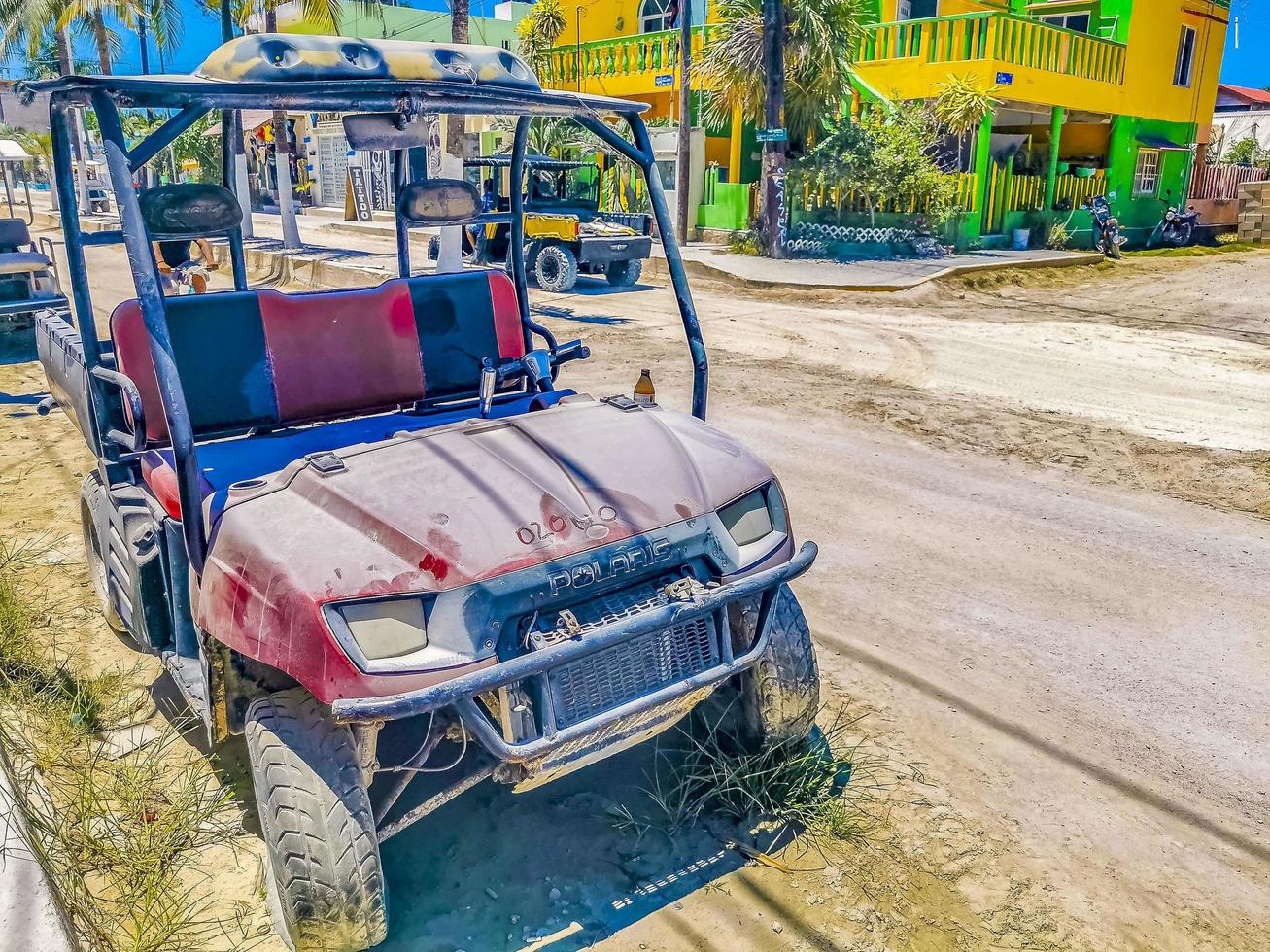 Holbox Quintana Roo Mexico 2022 Golf cart buggy cars carts muddy street village Holbox Mexico. photo