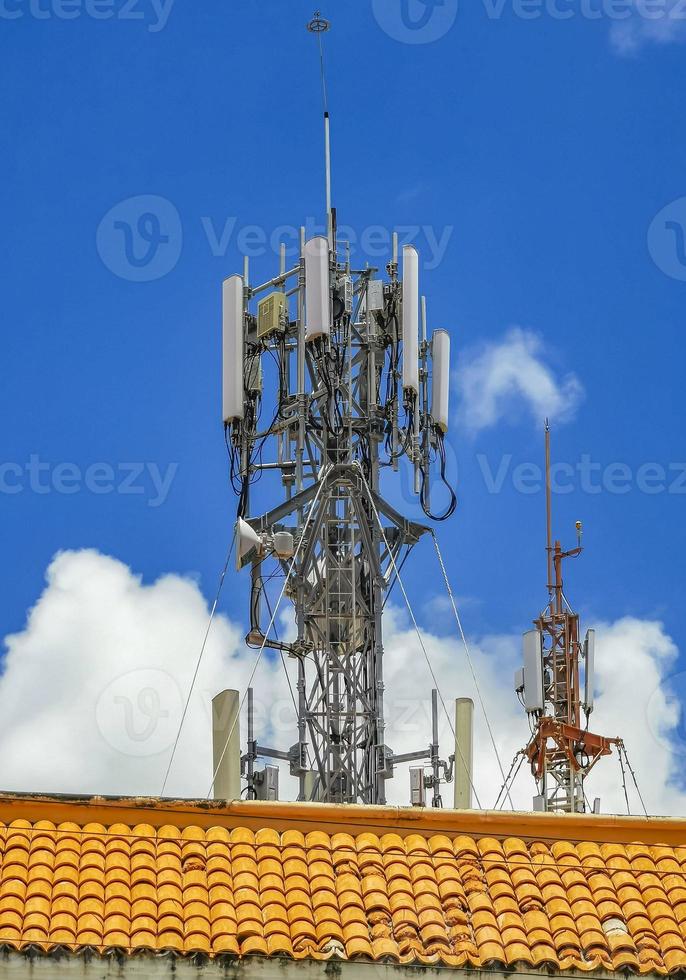 Red white 5G tower radiation in Playa del Carmen Mexico. photo