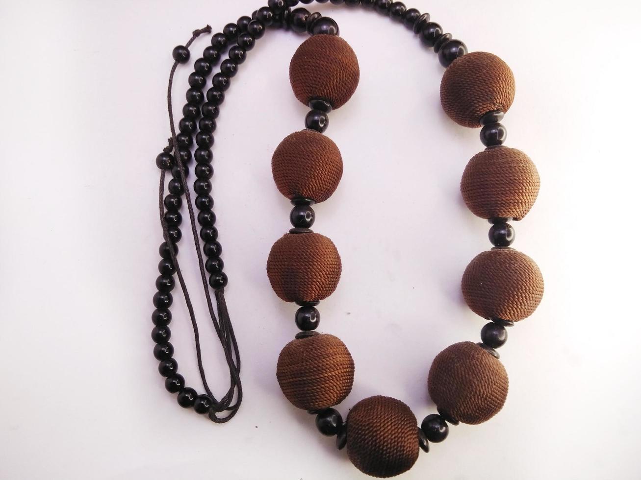 Women necklace. Collection of fashionable necklaces made of wood, beads isolated on a white background. Beauty, jewelry, accessory. photo