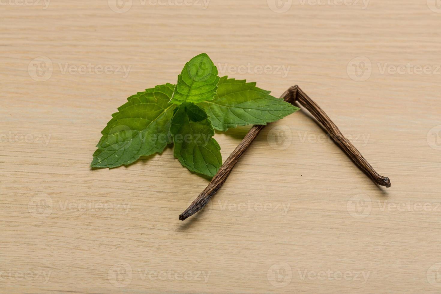 Vanilla on wooden background photo