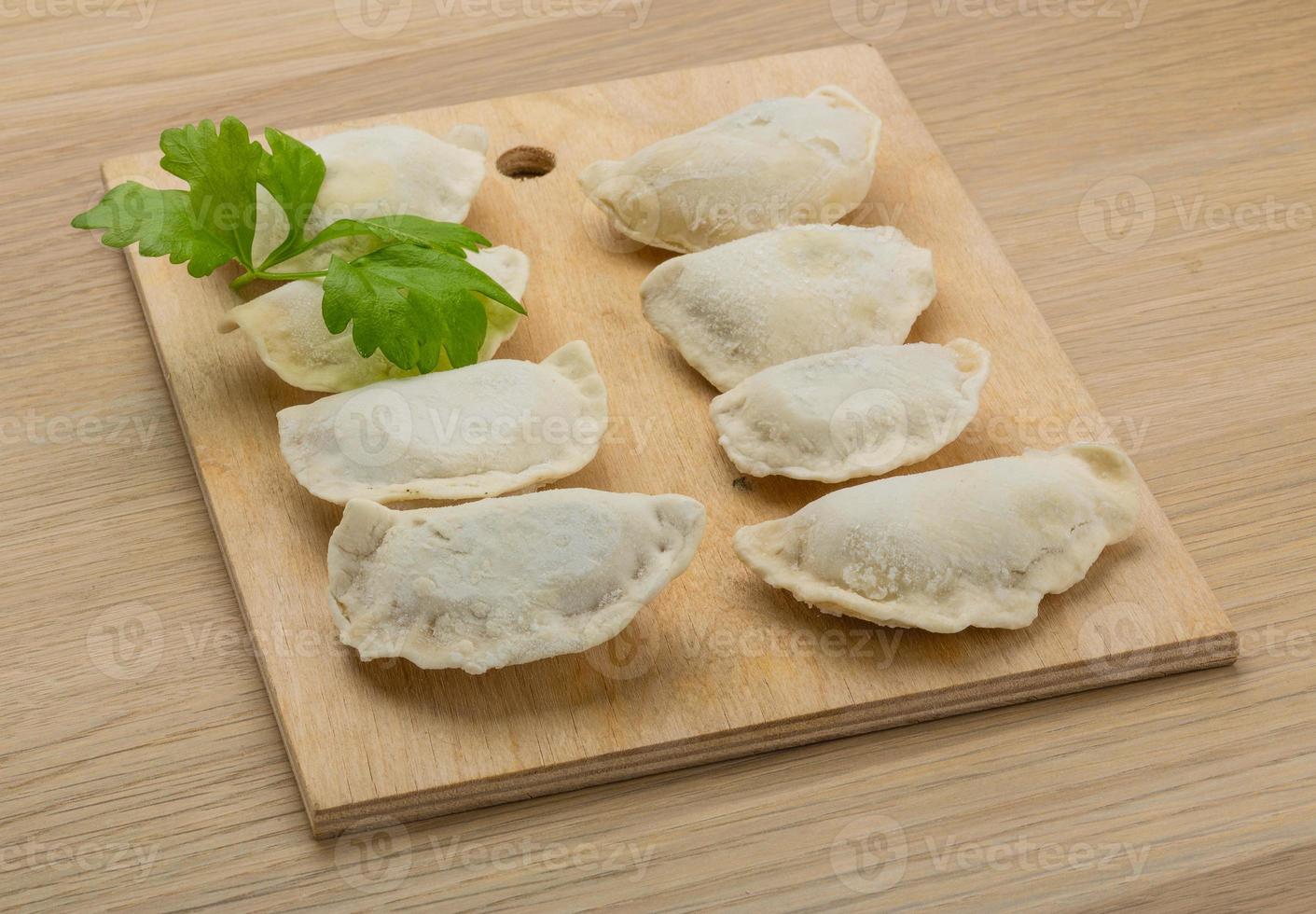 Ukrainian vareniki on wooden board and wooden background 11552481 Stock ...