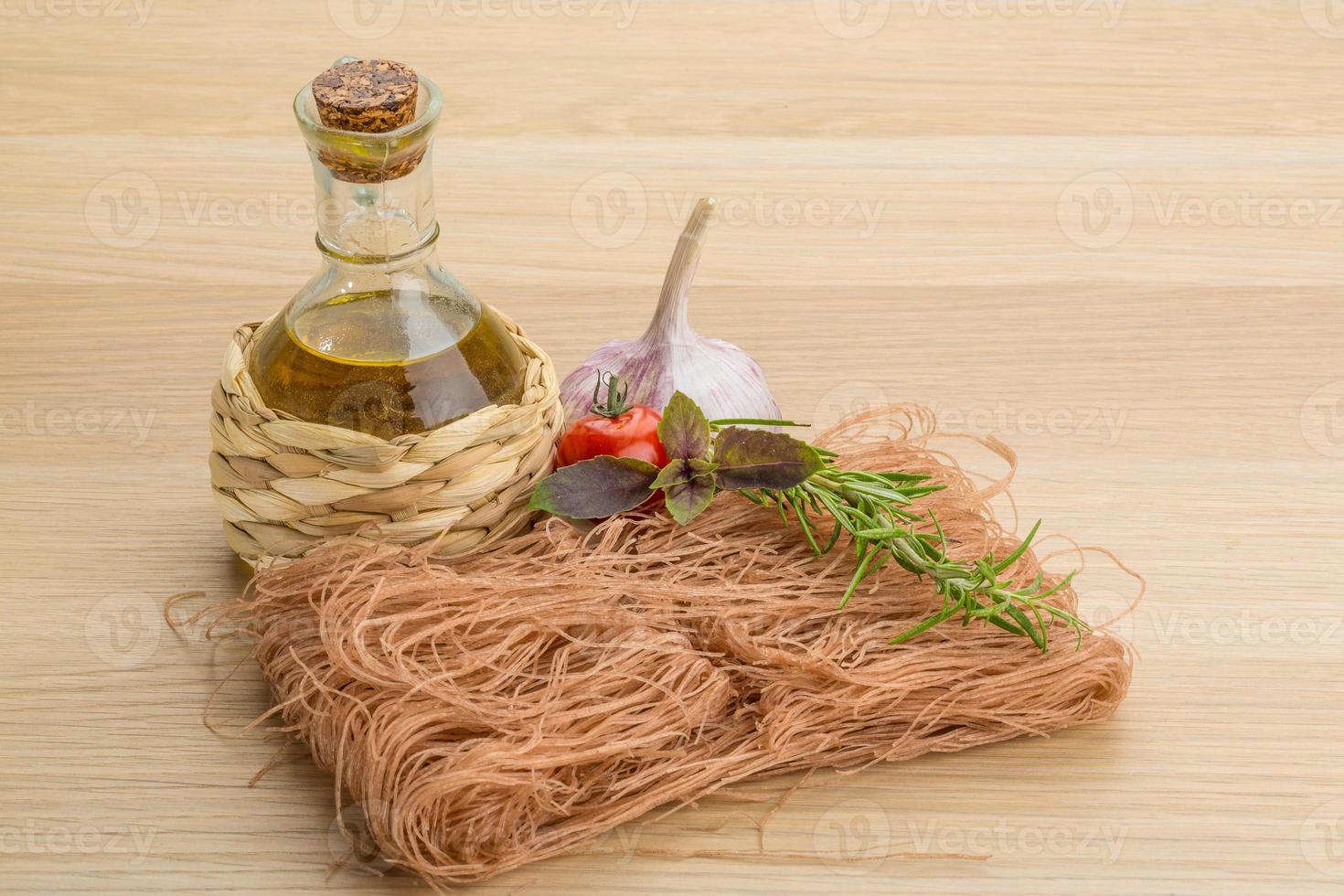 Raw soba on wooden background photo