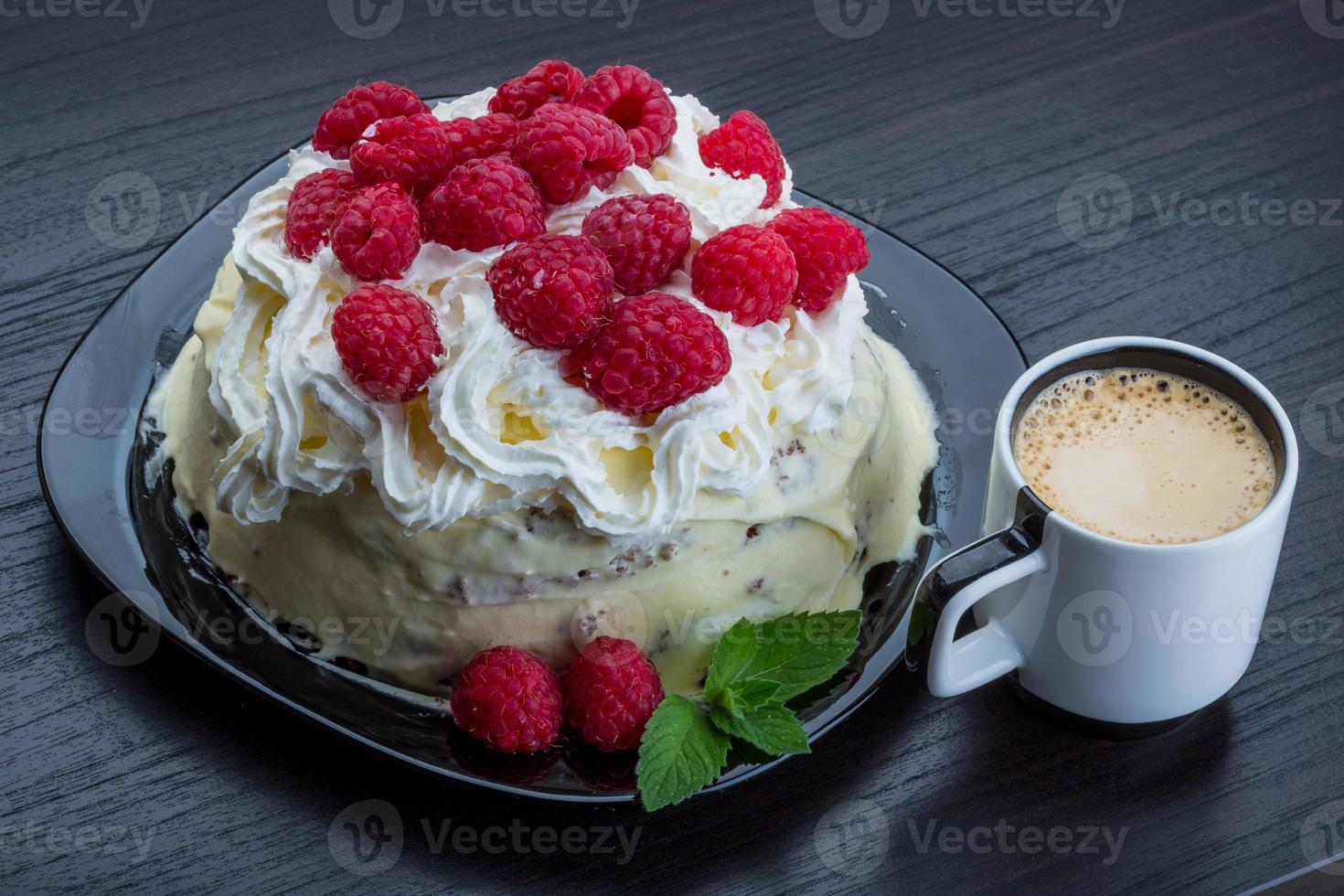 Coffee with raspberry cake on the plate close up view photo
