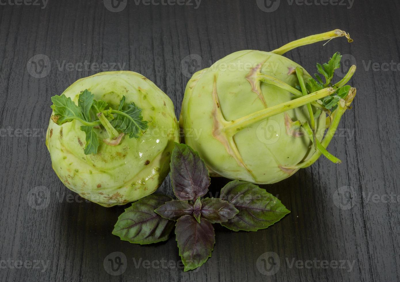 Kohlrabi on wooden background photo