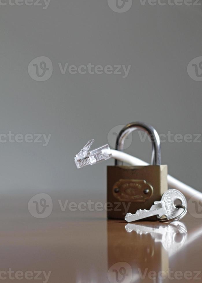 Network protection and secure access - network cable going through a padlock photo