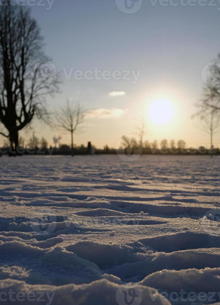 Tranquil winter sunset over a snowy landscape photo