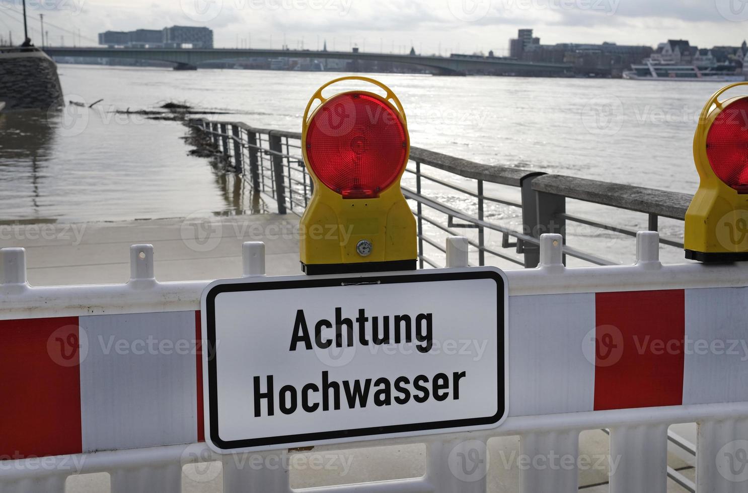Extreme weather - Warning sign in German at the entrance to a flooded pedestrian zone in Cologne, Germany photo