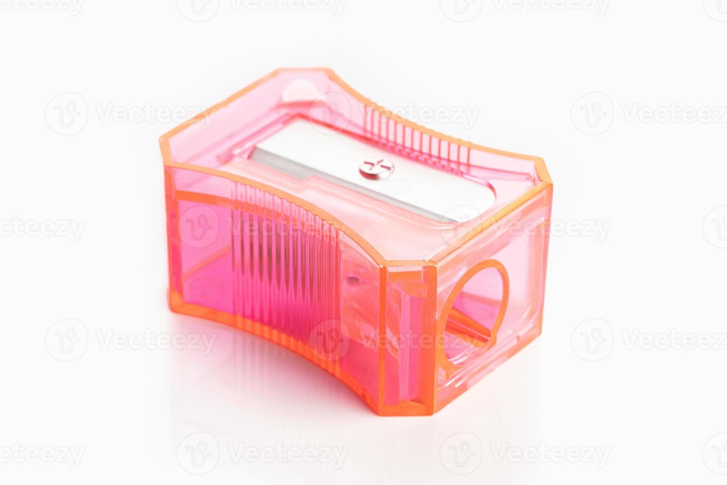 Pink pencil sharpener isolated on white background photo