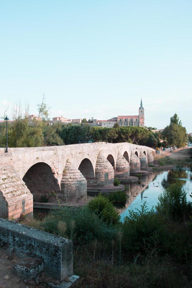 Old stone bridge over Arlanza river at Lerma, Burgos photo