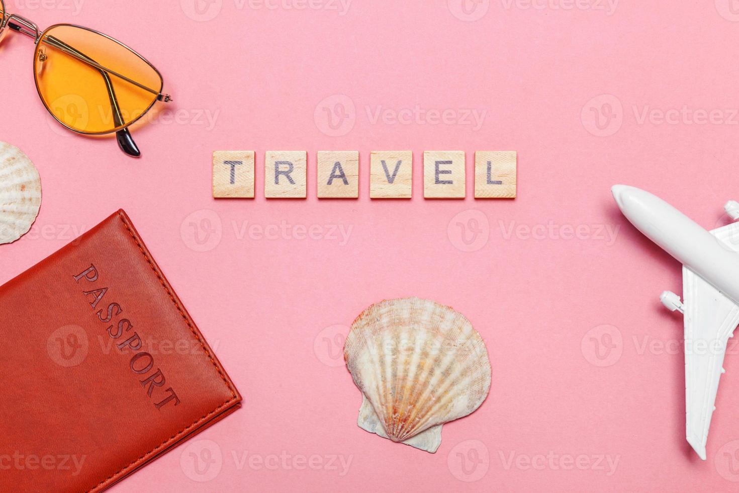 Minimal simple flat lay travel adventure trip concept on pink pastel trendy modern background photo