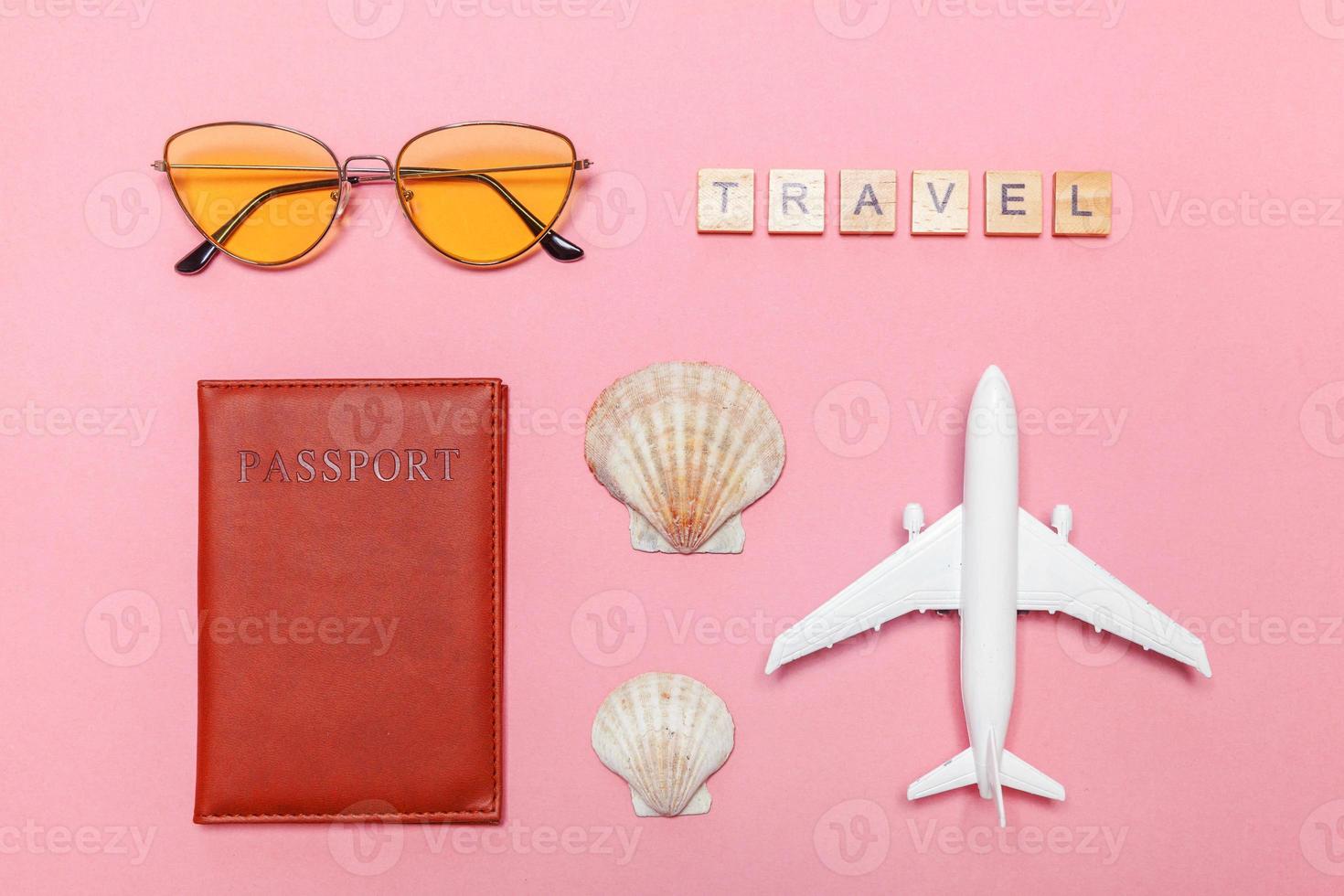 Minimal simple flat lay travel adventure trip concept on pink pastel trendy modern background photo