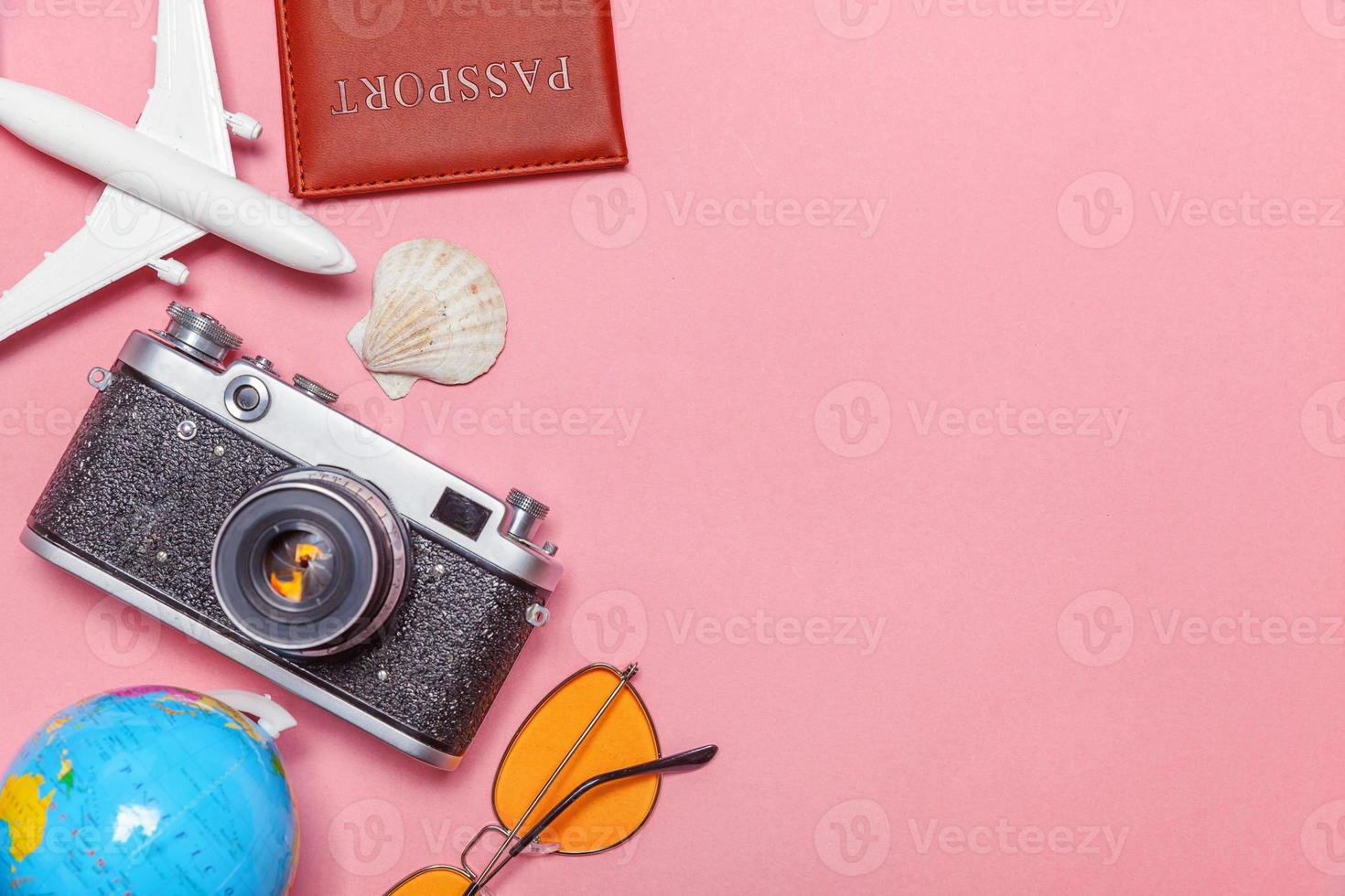 Minimal simple flat lay travel adventure trip concept on pink pastel trendy modern background photo