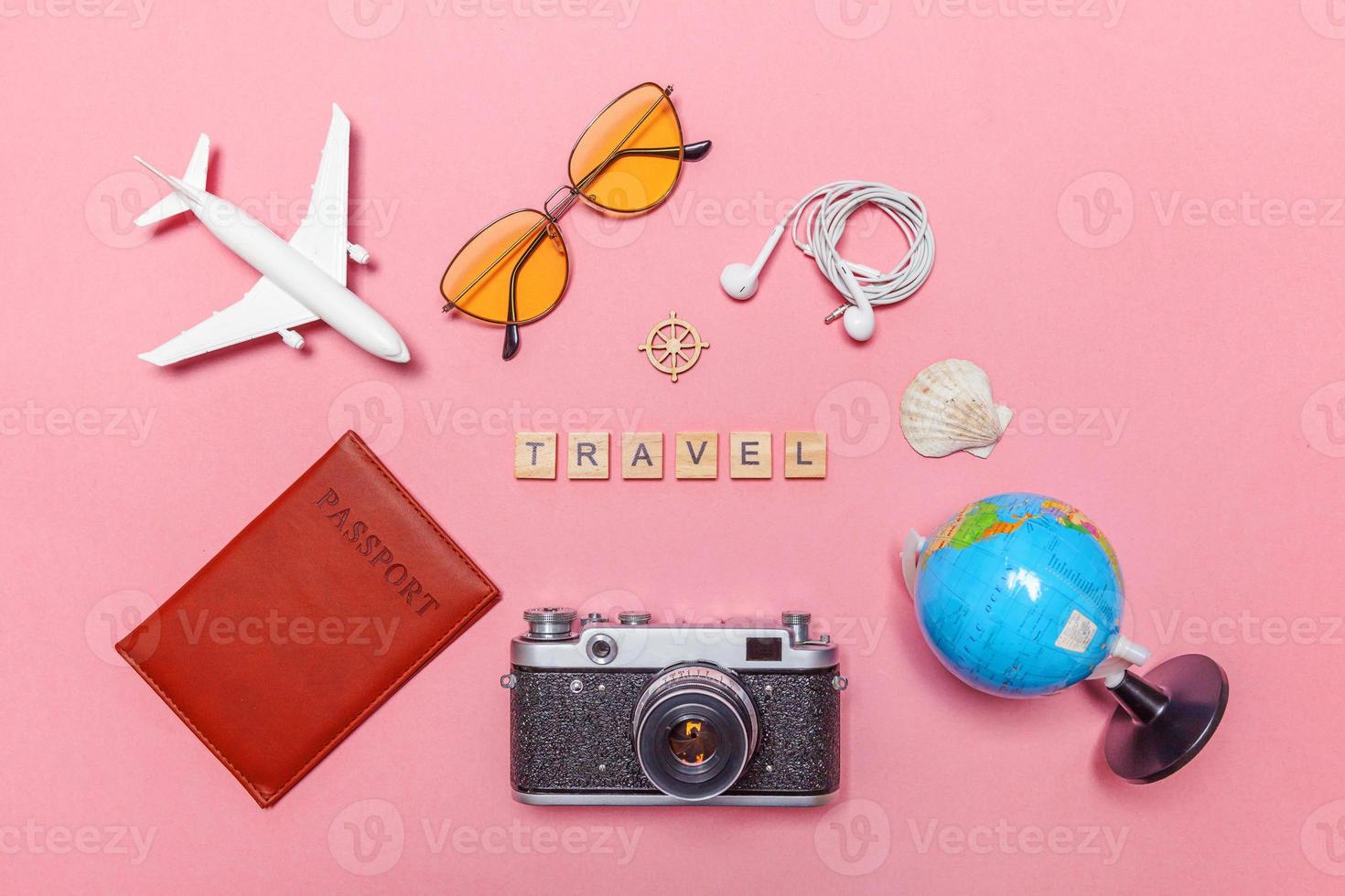 Minimal simple flat lay travel adventure trip concept on pink pastel trendy modern background photo