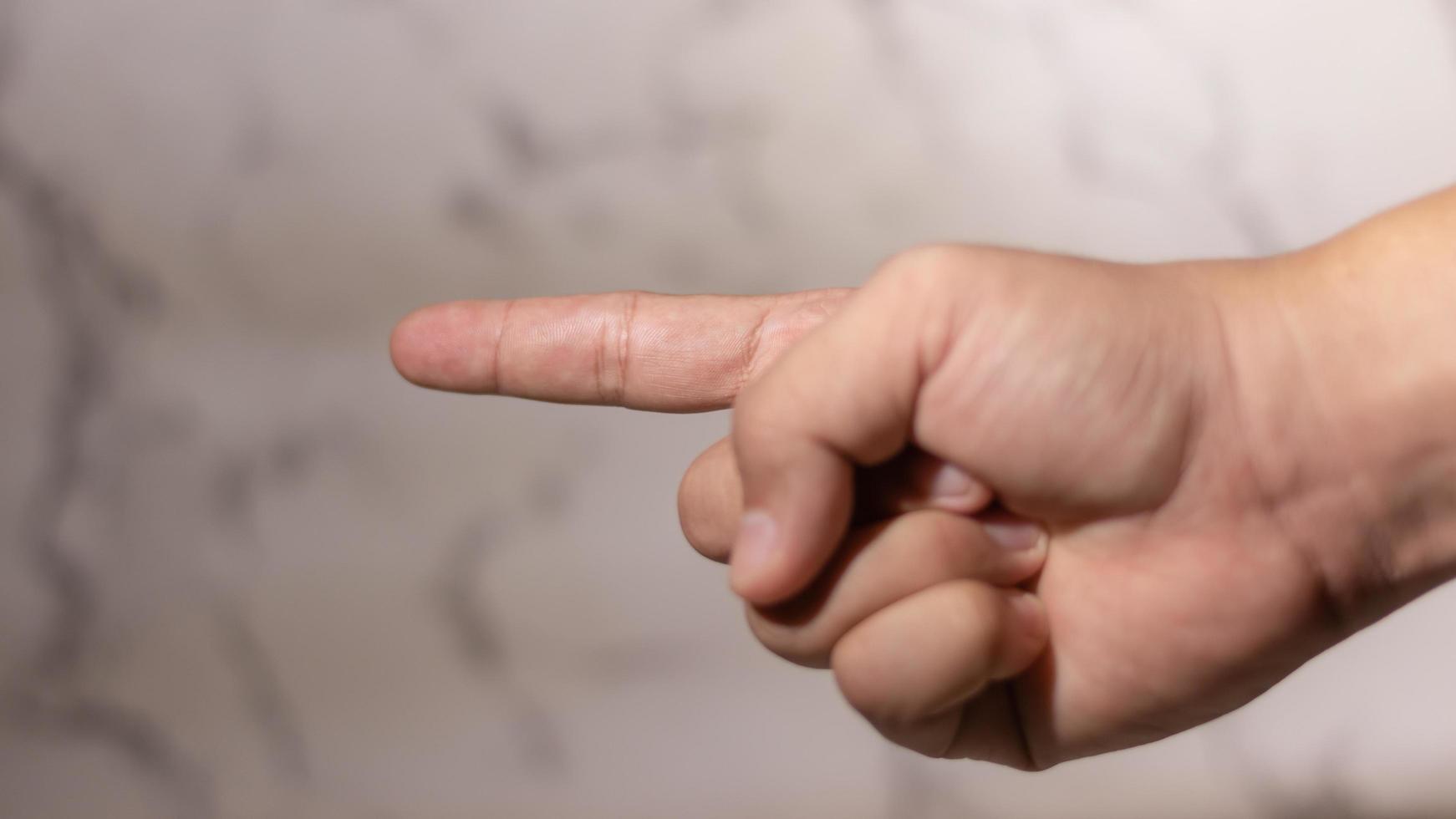 hand pointing to the side photo