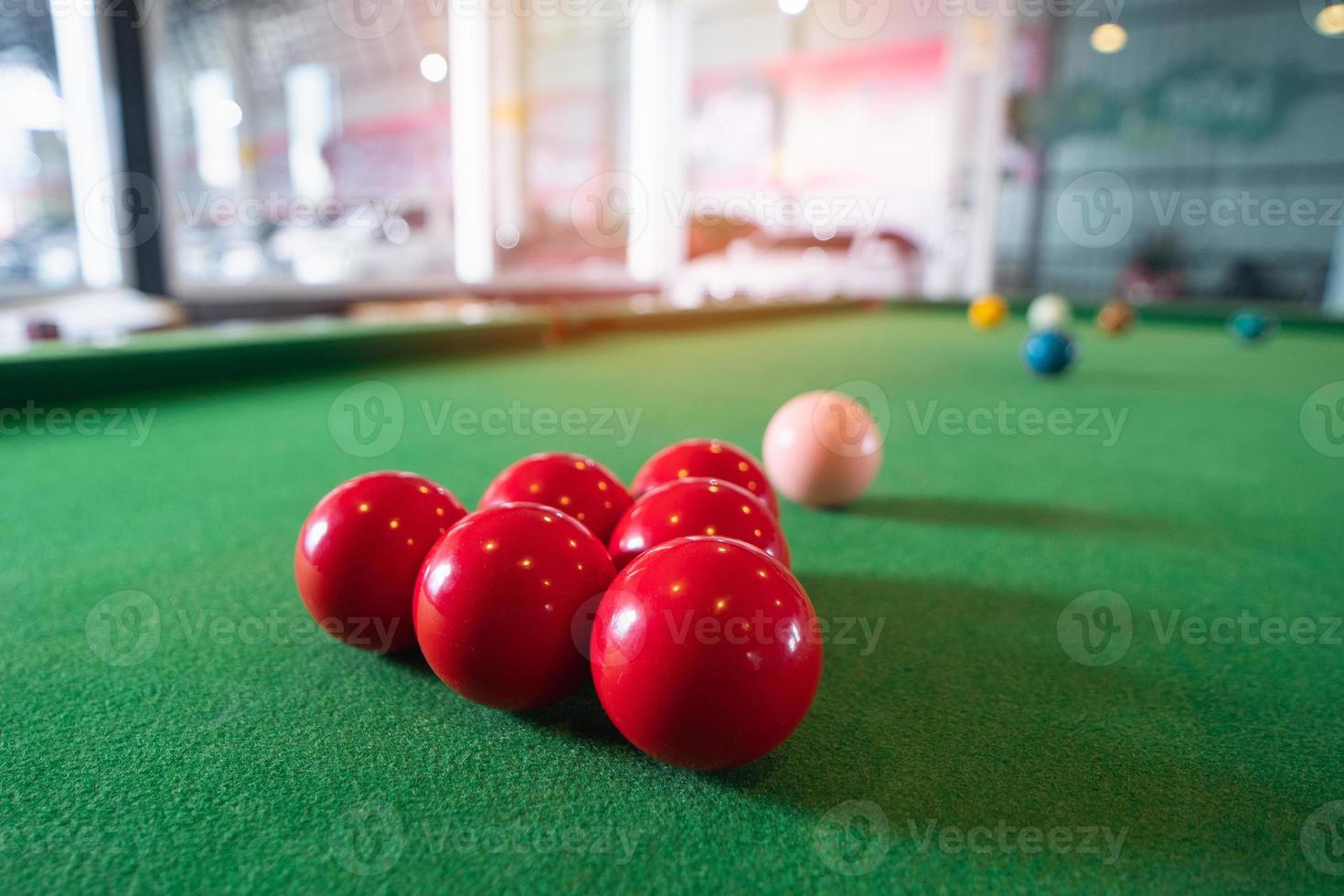 Close up on white and red snooker ball or pool on the snooker table. Snooker player competition snooker game, bet. Indoor snooker sport. photo