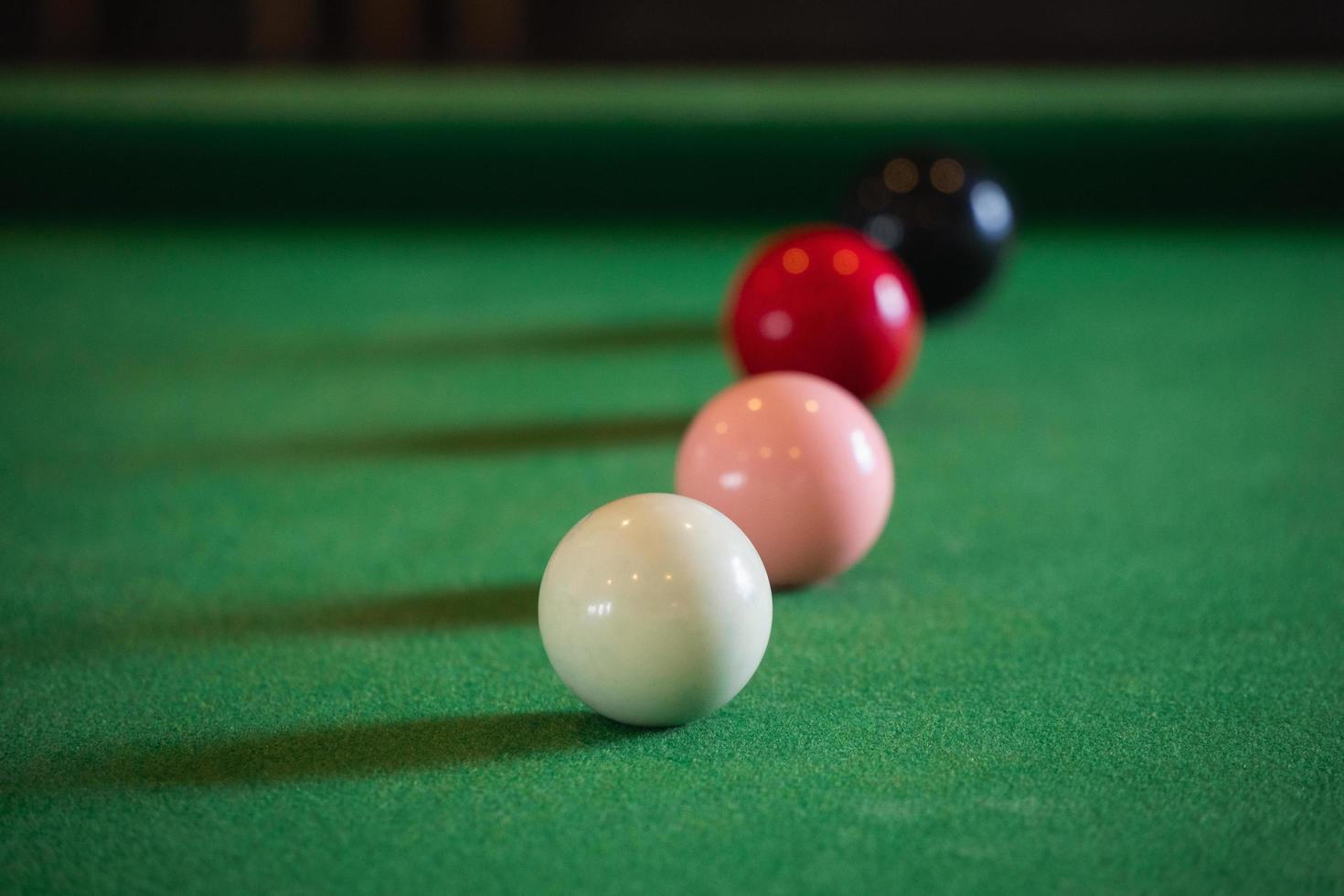 Close up on white and red snooker ball or pool on the snooker table. Snooker player competition snooker game, bet. Indoor snooker sport. photo