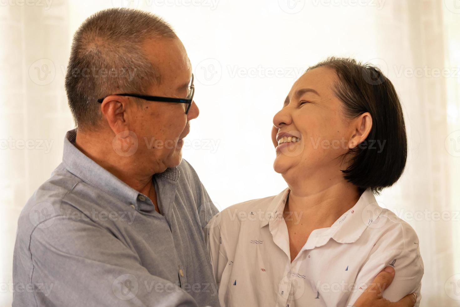 Happy asian couples staring together in the house. photo