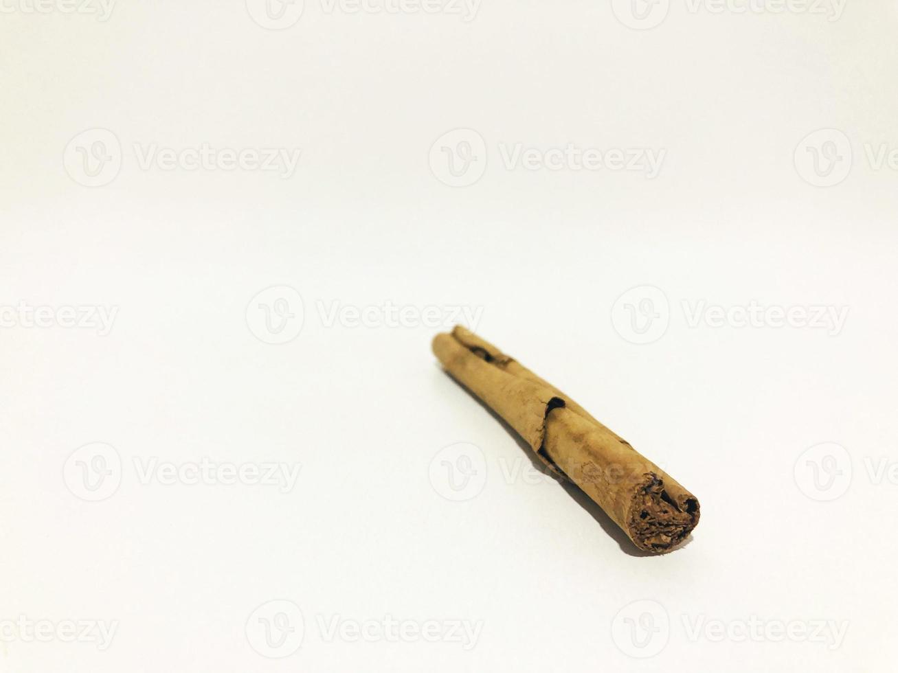 Fragrant cinnamon sticks on a white background photo