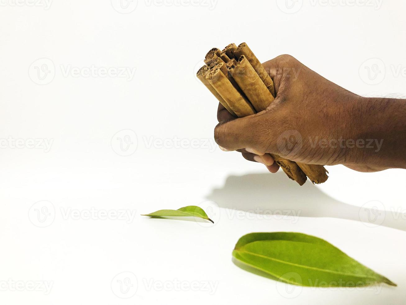 Fragrant cinnamon sticks on a white background photo