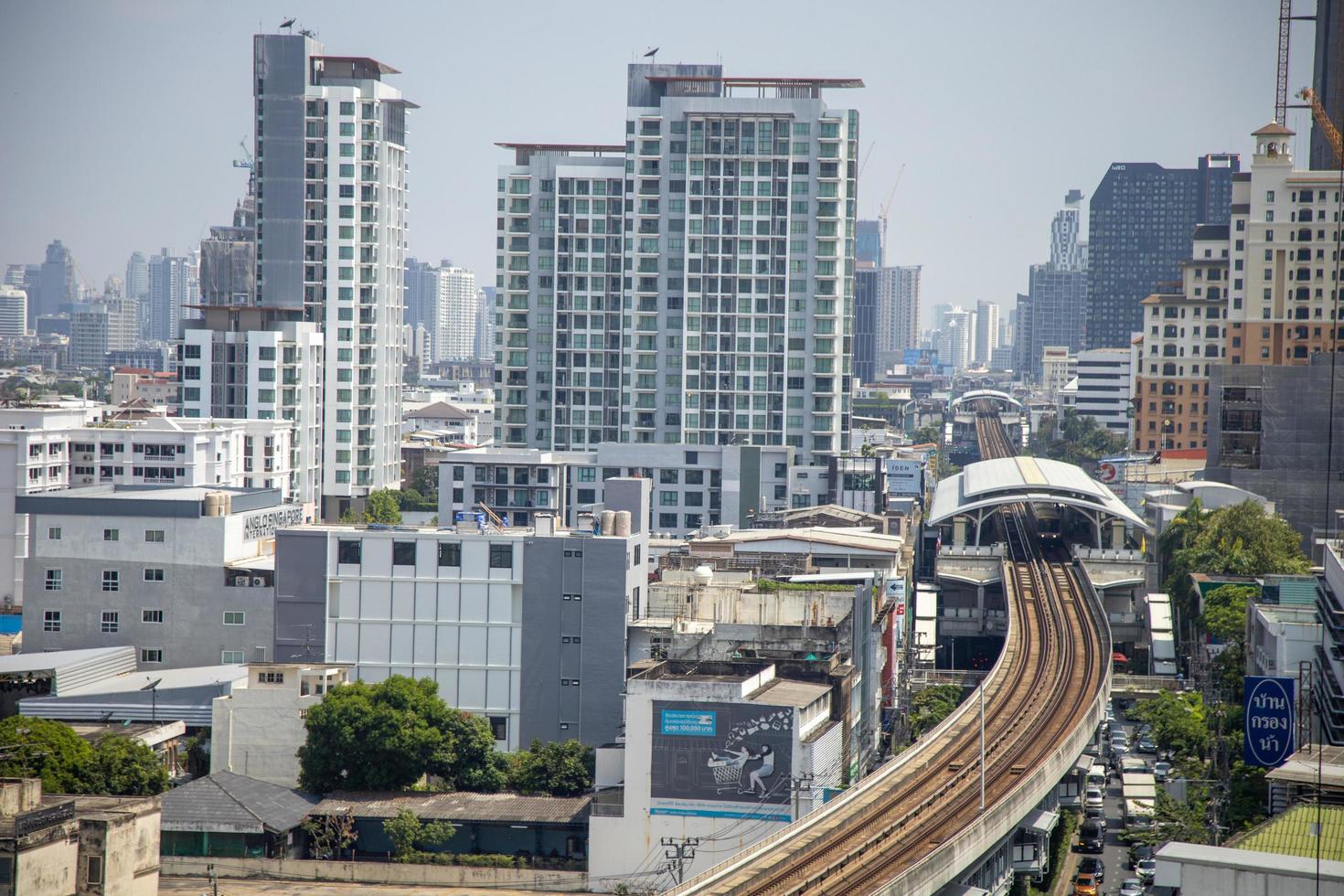 Punnawithi Station, Bangkok, Thailand - May 2022 Infrastructure of BTS skytrain in Sukhumvit Line with city building around area. Photo from aerial view on True Digital Park building.