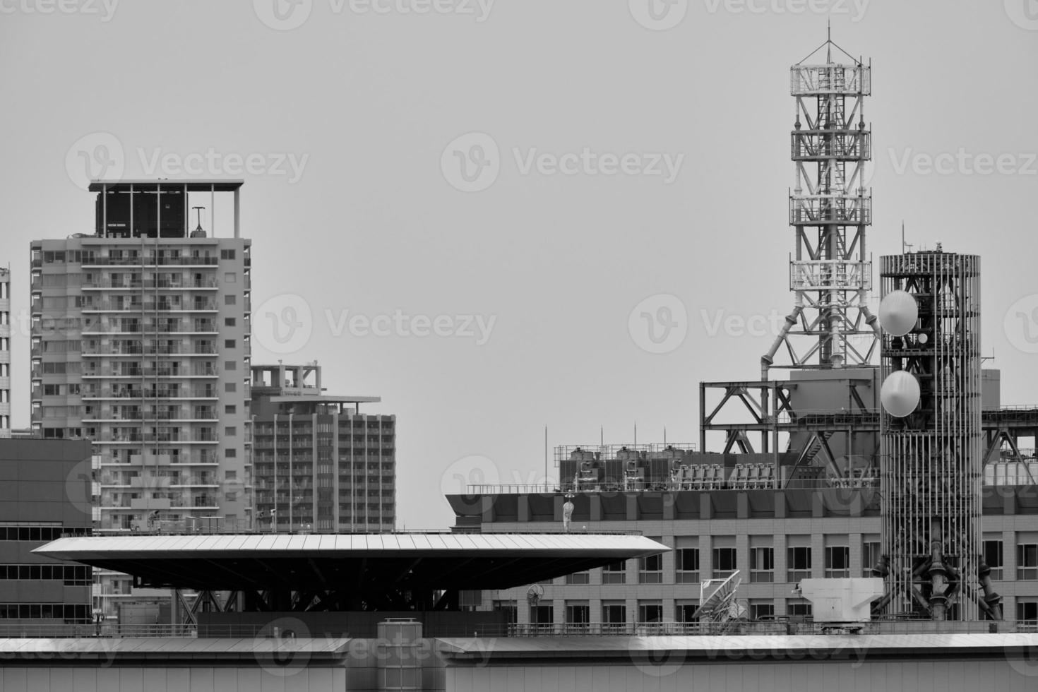 Roof tops and tall buildings in downtown Osaka photo