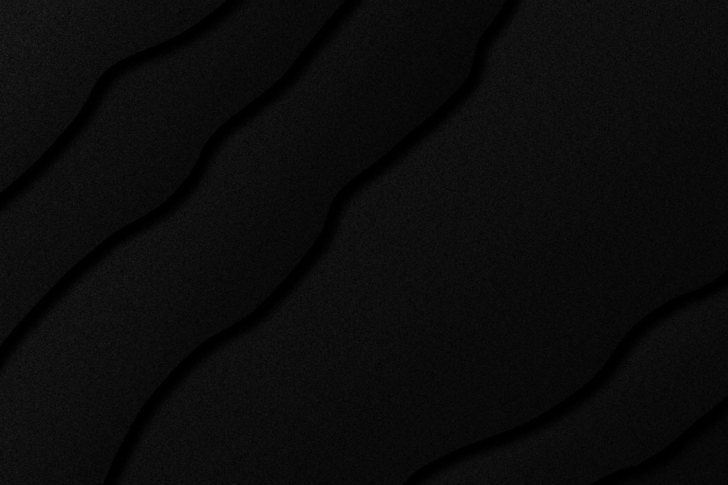 Wavy layers of black paper background photo