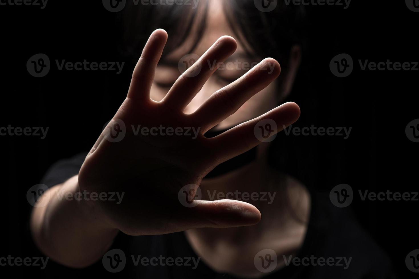 International Human Right day Concept. Women with her hand extended signaling to stop useful to campaign against violence, gender or sexual discrimination photo